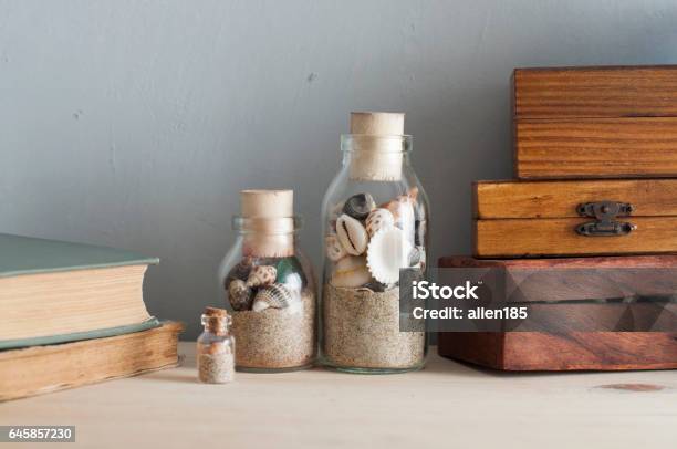 Memorabilia Stock Photo - Download Image Now - Bottle, Sand, Box - Container