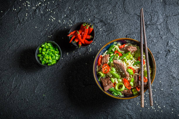 istock Enjoy your asian noodle with beef and vegetables 645863762
