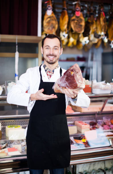 istock Seller offering piece of meat 645863814