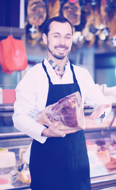istock Seller offering piece of meat 645863852
