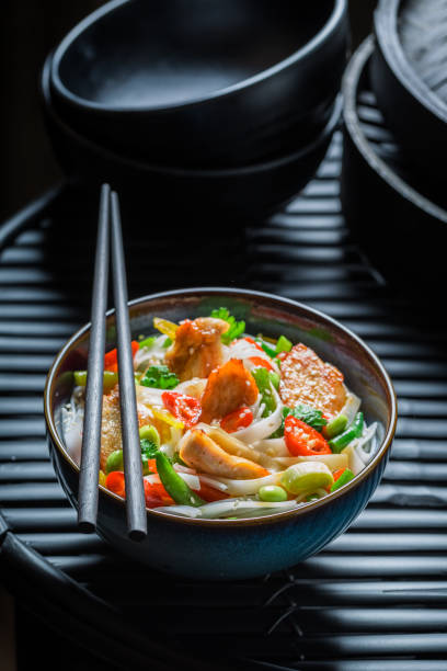 istock Hot noodle with chicken, vegetables and chili peppers 645864118