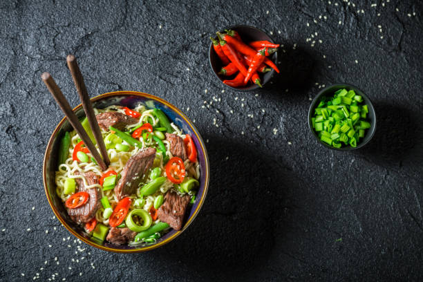 istock Spicy asian noodle with beef and vegetables 645864218