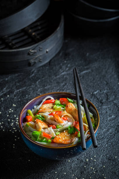 istock Delicious noodle with chicken, vegetables and chili peppers 645864252