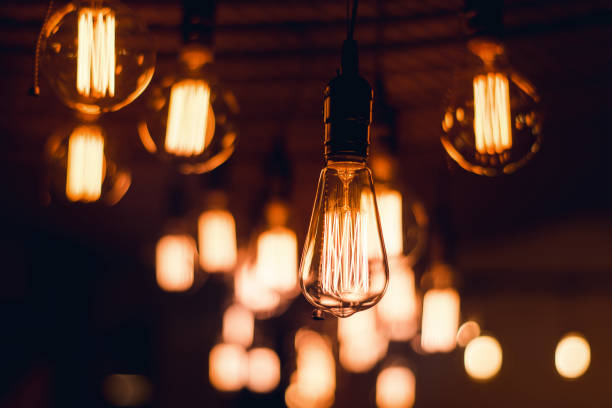 istock Blur lamp bulb in cafe 645889156