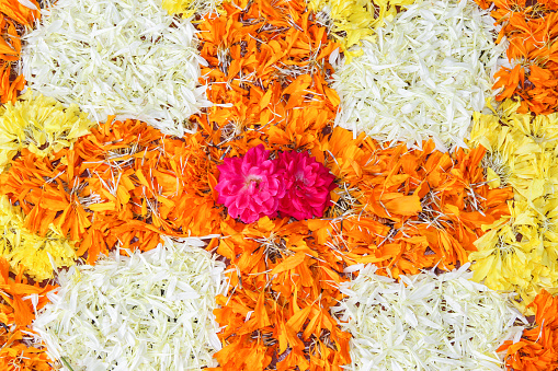 Onam Cultural Festival floral arrangement on the floor