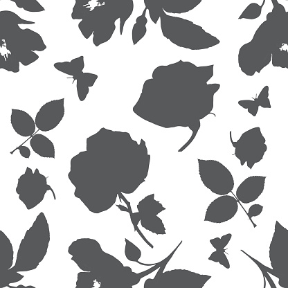 A seamless vector pattern with silhouettes of roses, butterflies, and leaves, on a white background