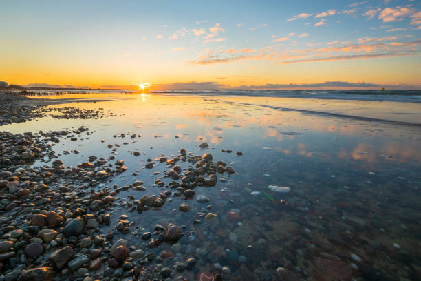 istock Baltic sea at beautiful sunrise,stony beach after storm 645929790