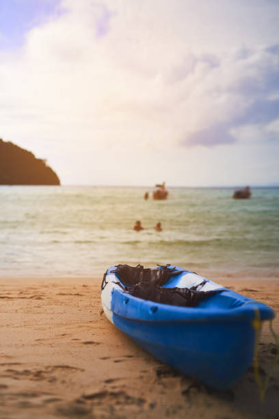 Shot of a single canoe on the shore of a tropical beach