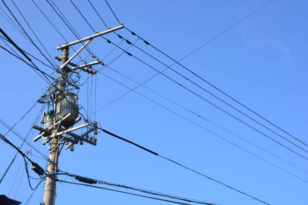 istock electricity transmission pylon against blue sky 645945234