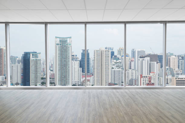 istock Interior space of modern empty office with city view background 645948972