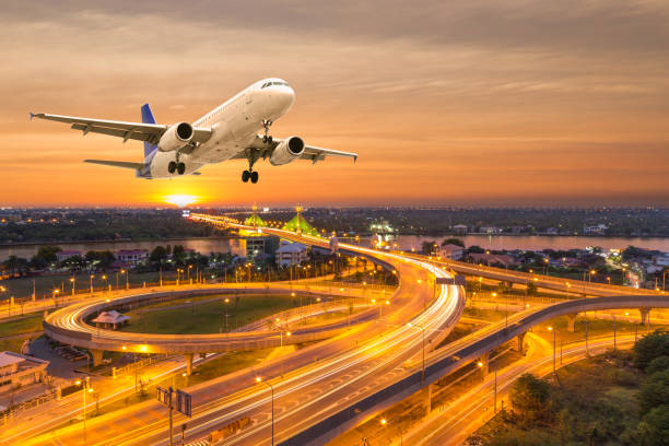 istock Airplane take off over the panorama city at twilight scene 645948982