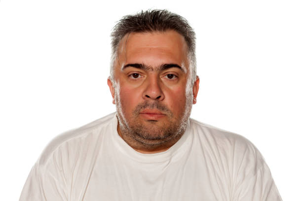 istock Portrait of a serious obese man 645980946