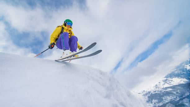 istock Man jumping with skies 645984326
