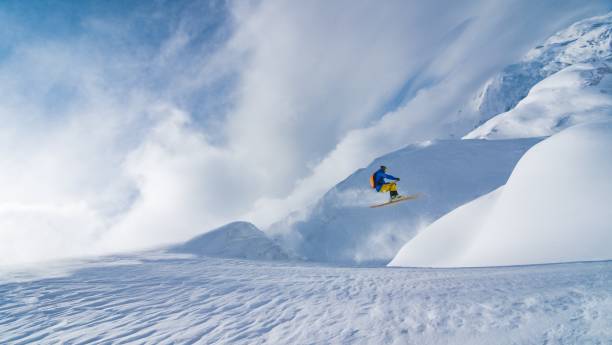 istock Man jumping with skies 645984330