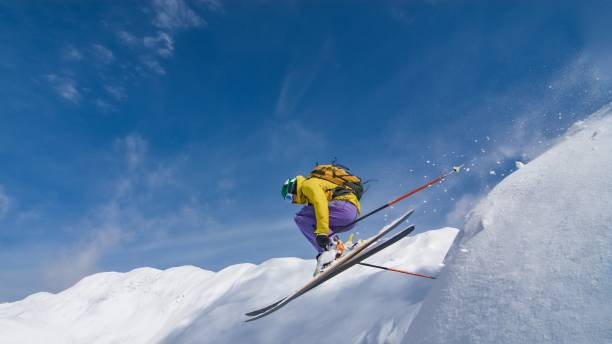 istock Man jumping with skies 645984348