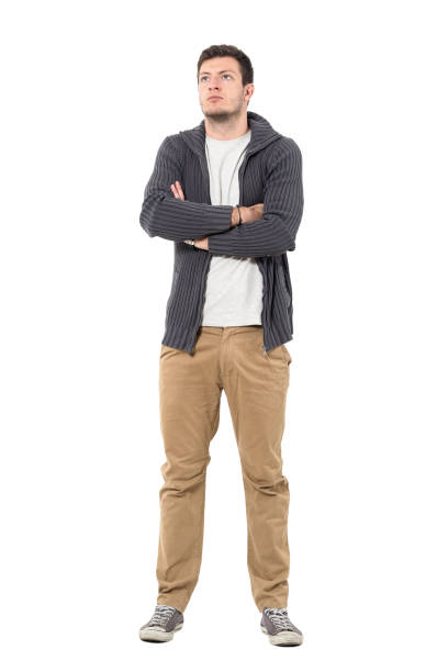 istock Confident casual man with crossed arms looking up 645984930