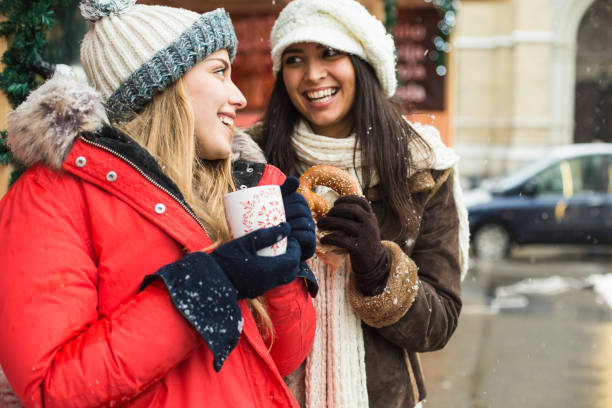 istock Two friends at Christmas market 645990564