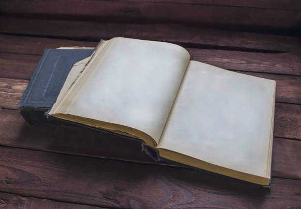 istock Two old books on wooden table . Ready to read 645990632