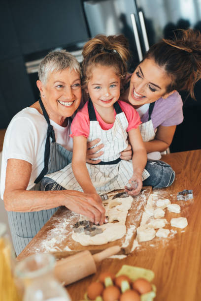 istock Family making cookies in the kitchen 645994386
