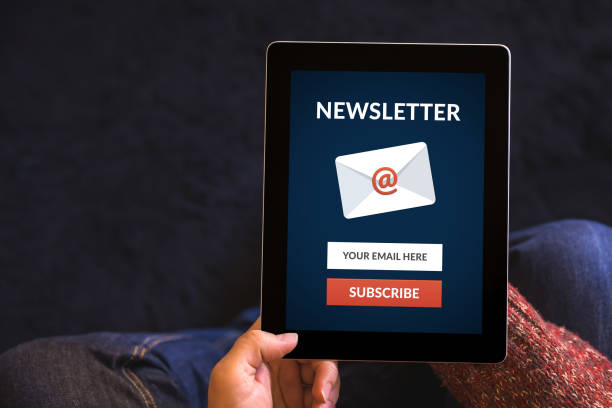 istock Hands holding tablet computer with subscribe newsletter concept on screen 645997616
