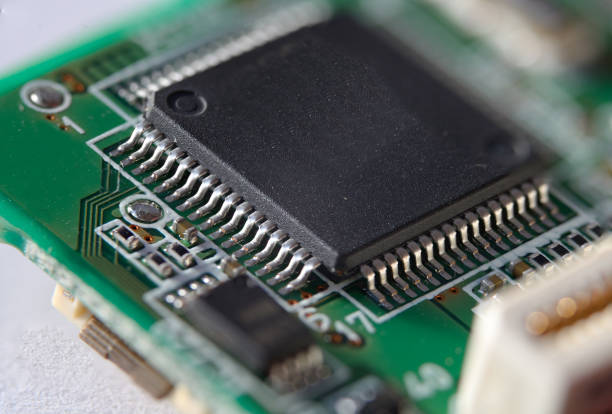 istock Integrated circuit in  Quad Flat Package on circuit board 646001758