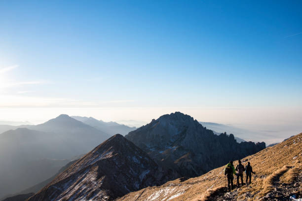 istock Trekkers walking on mountain up trail 646004788