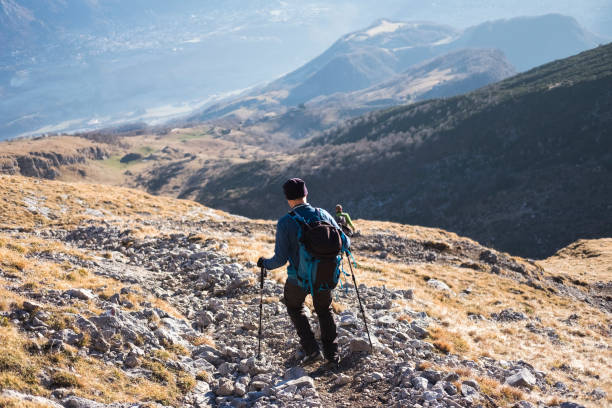 istock Hiker descends from the mountain following the path 646004804