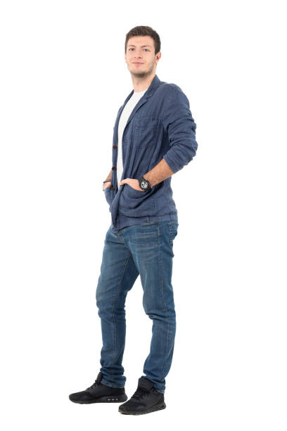 istock Smiling man wearing denim shirt with hands in pockets 646011542