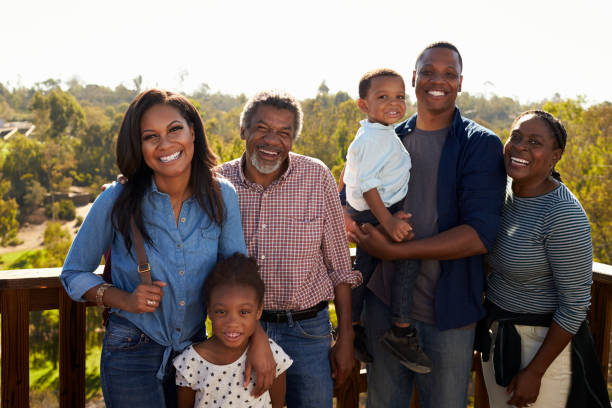 istock Multi Generation Family Standing On Outdoor Observation Deck 646011802