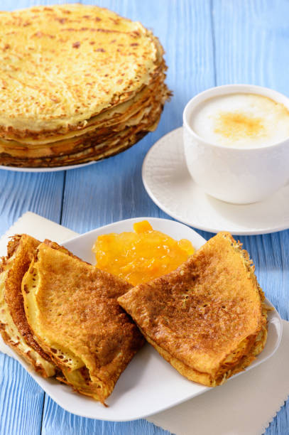 istock Pancakes with jam and cup of coffee. 646019738