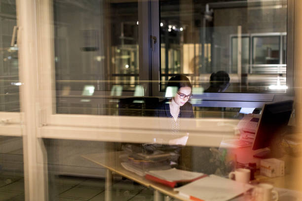 istock Businesswoman working late in office 646032788