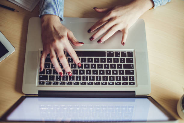 istock Close up of woman using laptop 646036882