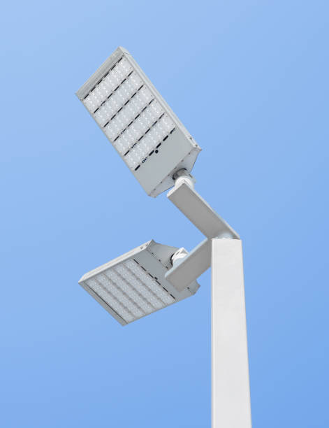 istock Street light pole led lamp lightbulb on blue sky background 646039526