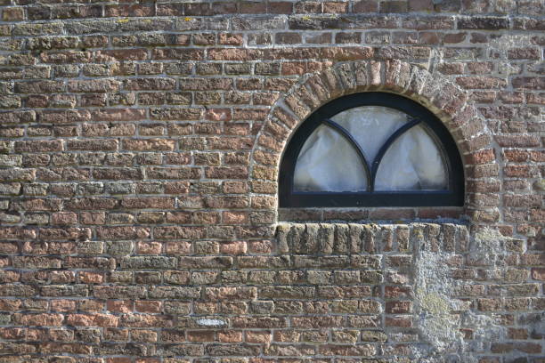 istock a stone wall with window in a farmers house 646039864