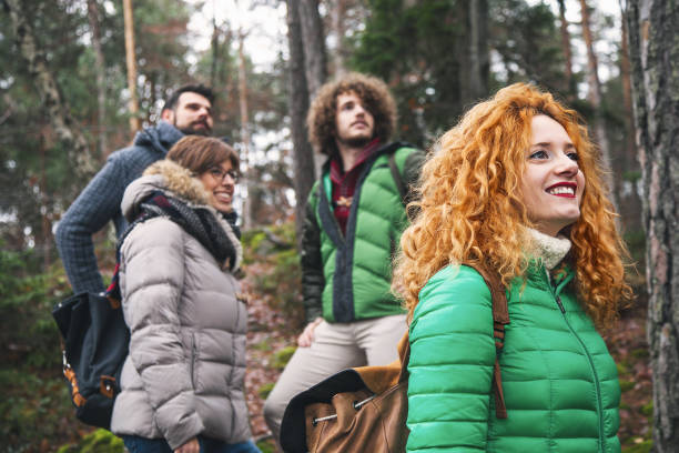 istock Group of friend walking into wood 646040642