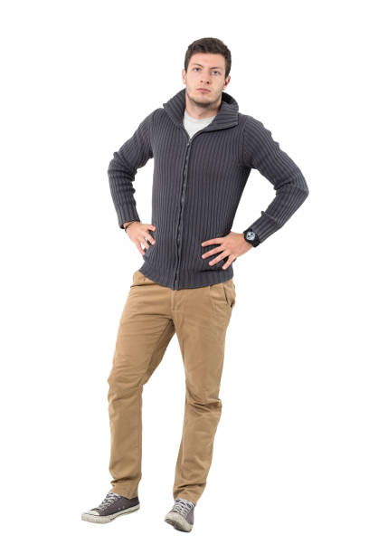 istock Handsome casual man wearing zipper sweater with hands on hips. 646047936