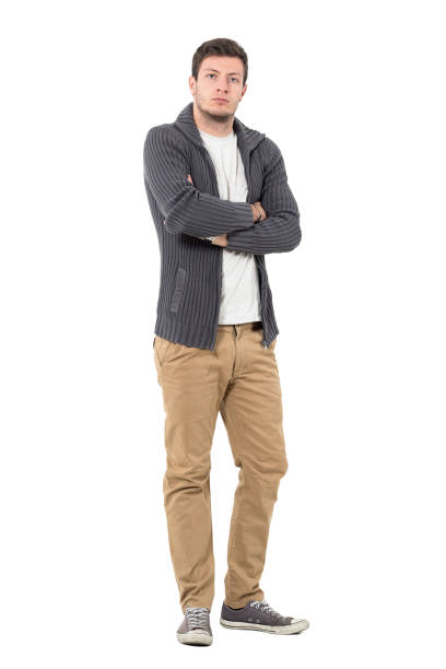 istock Serious man in sweater with crossed arms looking at camera 646048088