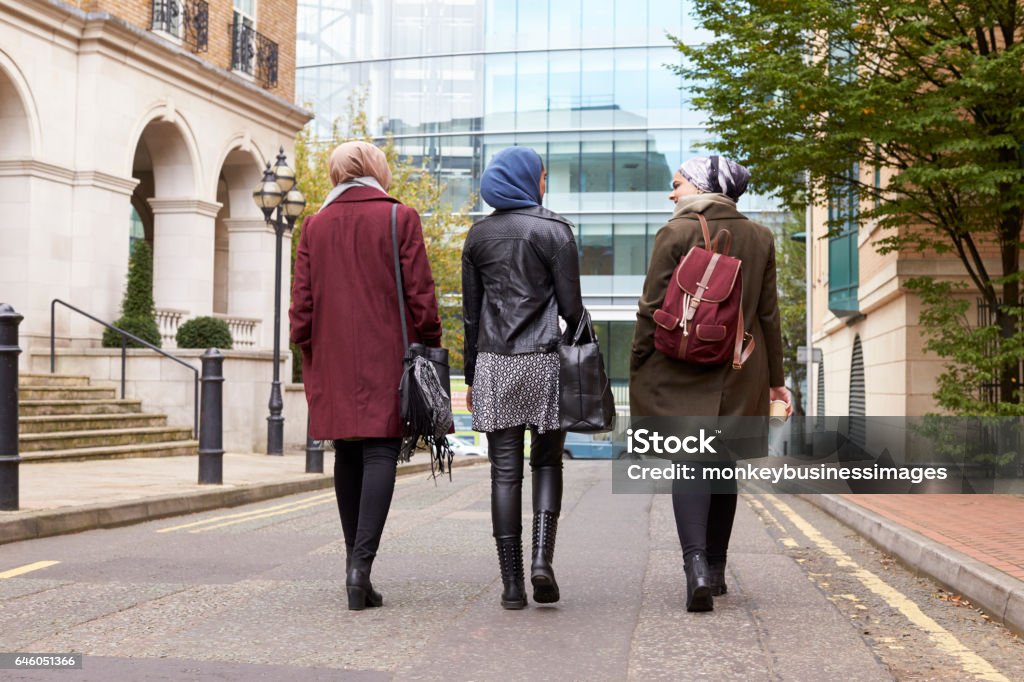 Group Of British Muslim Businesswomen Returning To Office Women Stock Photo