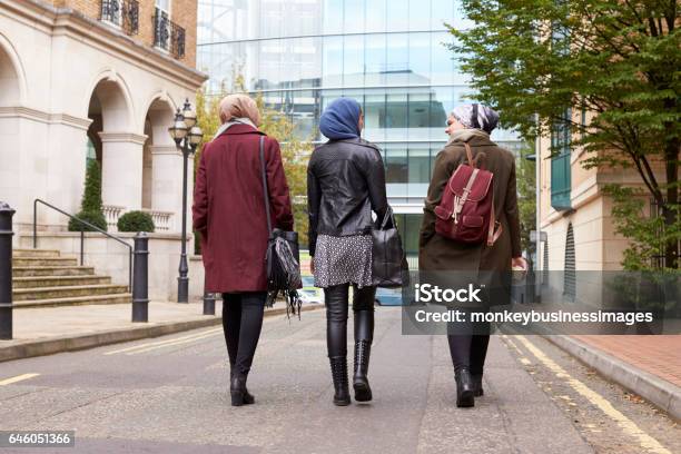 Group Of British Muslim Businesswomen Returning To Office Stock Photo - Download Image Now