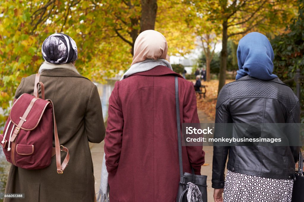 British Muslim Female Friends Walking In Urban Environment Islam Stock Photo