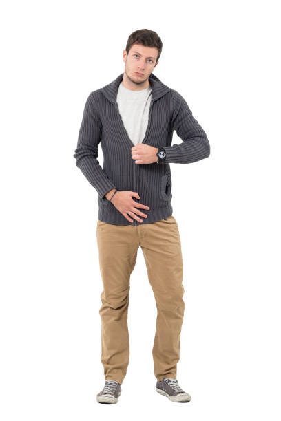 istock Casual man zipping jumper sweater looking at camera. 646051608