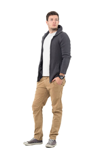istock Handsome man in gray unzipped sweater with hands in pockets 646051758