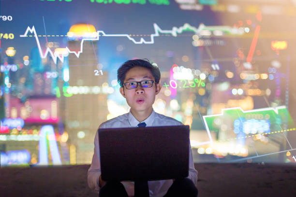 istock Young business man using laptop cityscape background 646054714