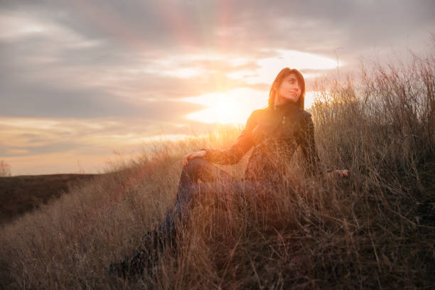 istock Thoughtful woman and beautiful sunset 646055500