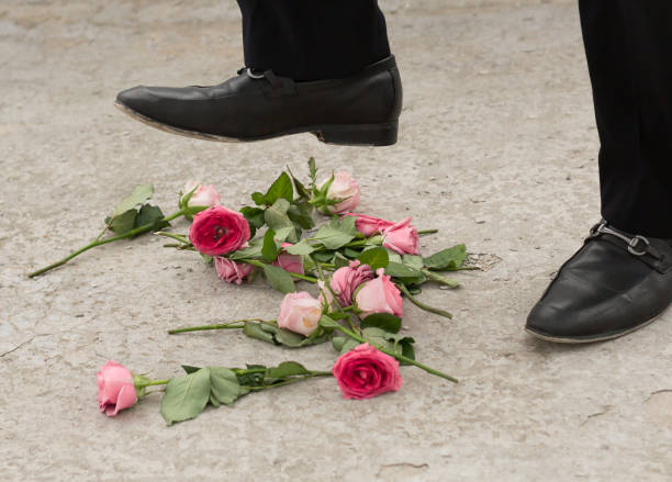 istock Roses being stomped on by a broken-hearted person 646058746