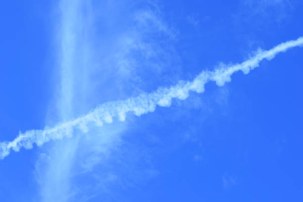 istock contrail of airplane on blue sky 646058748