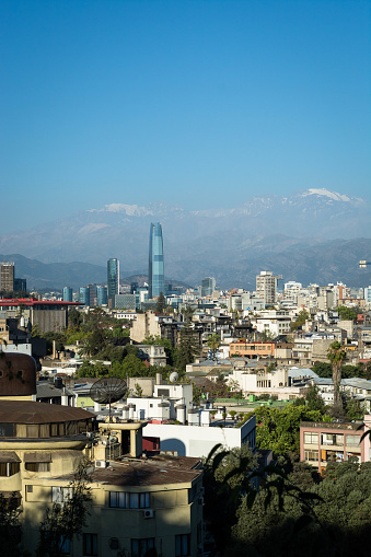 View over the city center of Santiago de Chile, modern and old buildings under the Aden range.