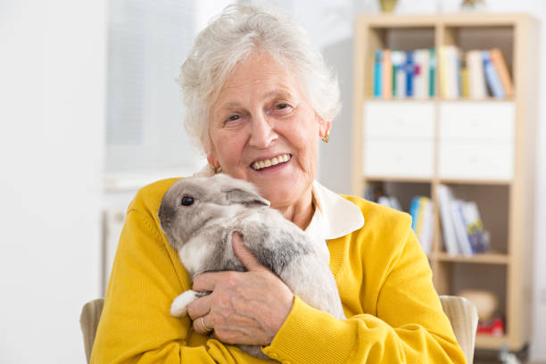 Senior woman with a little rabbit
