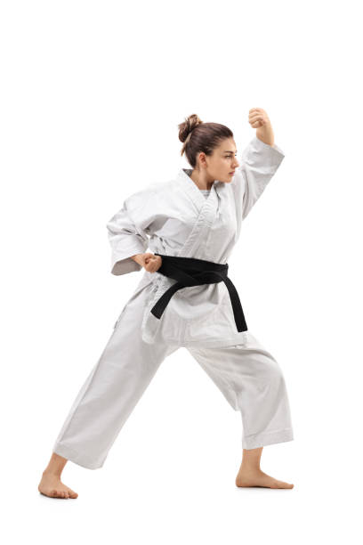 istock Girl wearing a kimono practicing karate 646061450