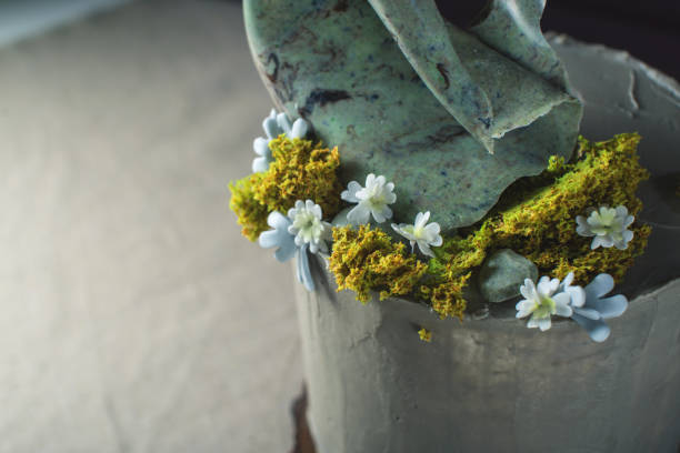 istock wedding cake decorated with stone and moss and forest flowers 646062232